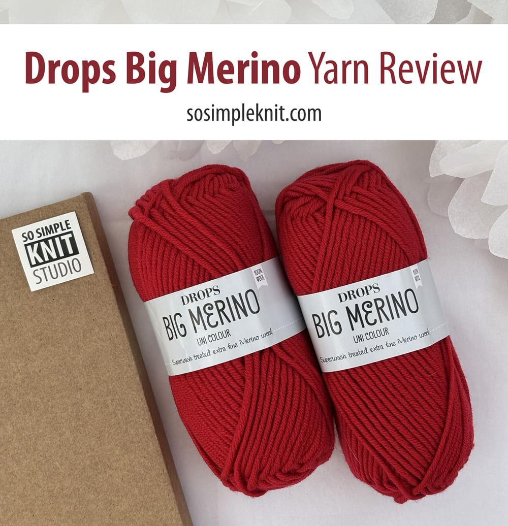 Two skeins of red Drops Big Merino yarn on a light background with a knitting notebook, featuring the text “Drops Big Merino Yarn Review” and sosimpleknit.com