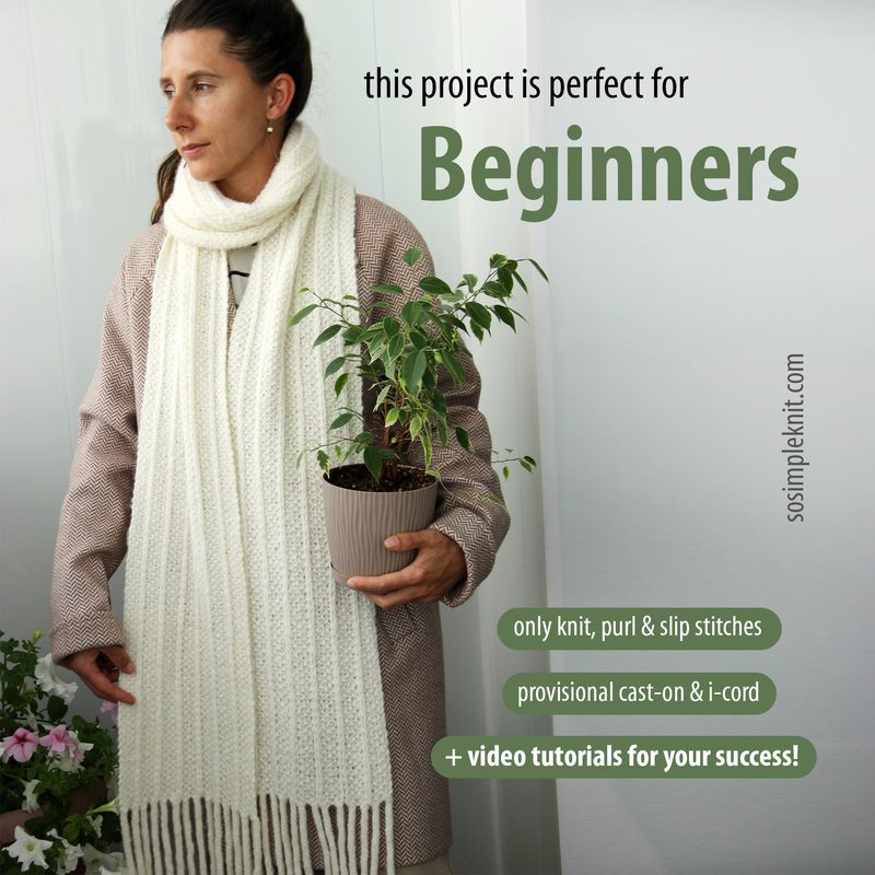 A woman stands holding a potted plant in her left hand while wearing a long, white, knitted scarf draped around her neck. She is dressed in a light brown, textured coat. The scarf features a ribbed texture and has long fringes at the ends. The background is a neutral tone, highlighting the subject and the scarf. The text on the image indicates that the project is suitable for beginners and lists basic knitting techniques.