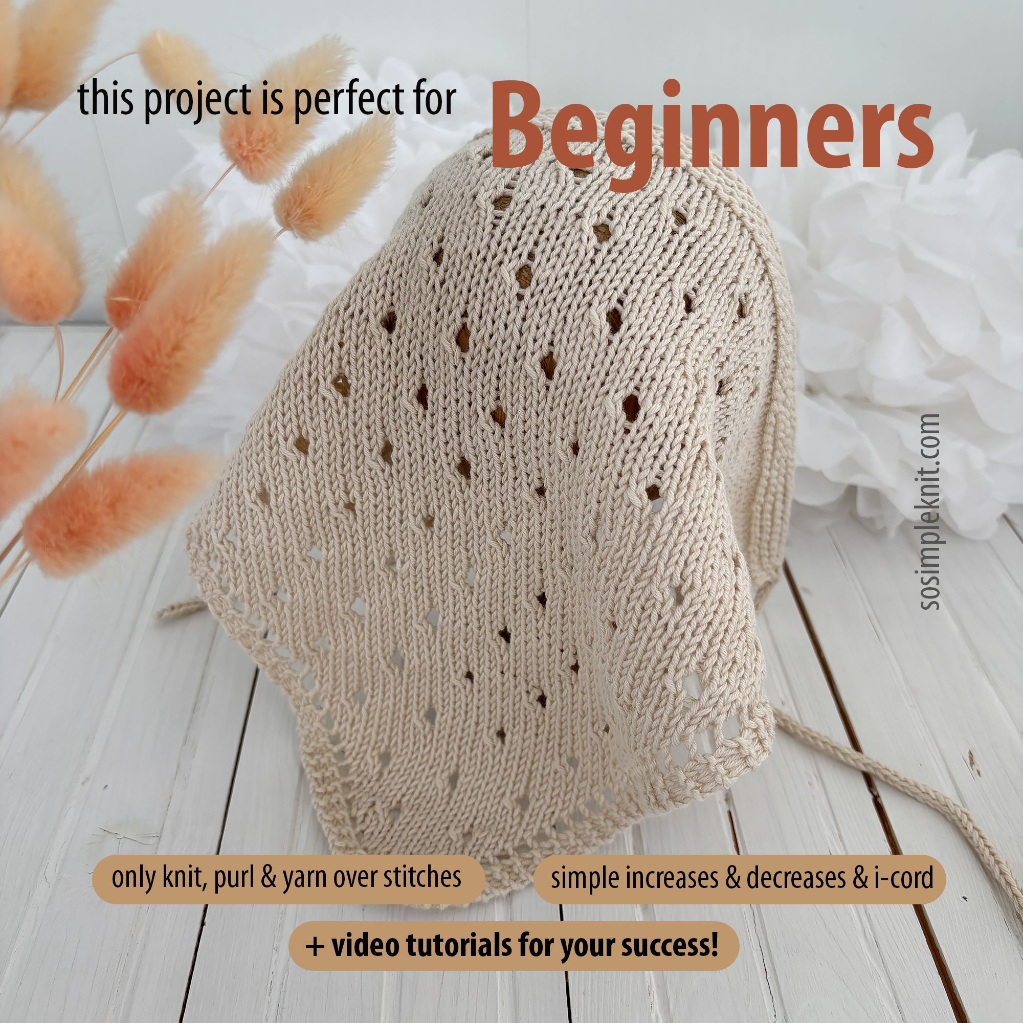 The image features a knitted triangle scarf displayed on a light wooden surface, draped casually with its tip pointing towards the viewer. The scarf showcases a delicate, open hole pattern in a soft beige color. In the background, there are light, textured white and pale pink elements resembling flowers or fabric. Text overlays include the words "Beginners" in bold red, accompanied by descriptions of the project's simplicity and resources for learning. The overall composition has a warm and invi