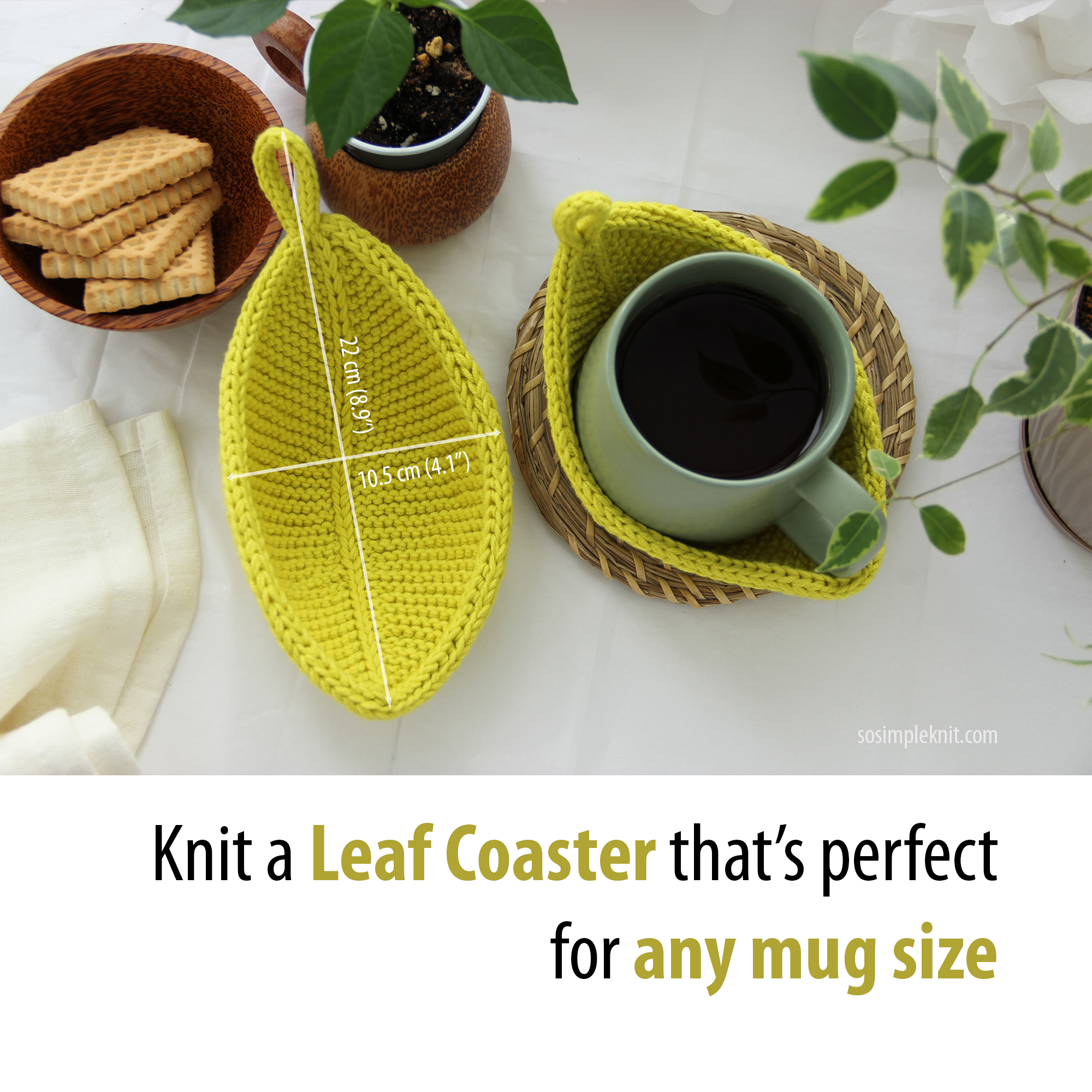 Styled table setting with knitted leaf-shaped coasters: one light green coaster lies on the table, another holds a green cup of tea, with greenery nearby, cozy nature-inspired table decor.