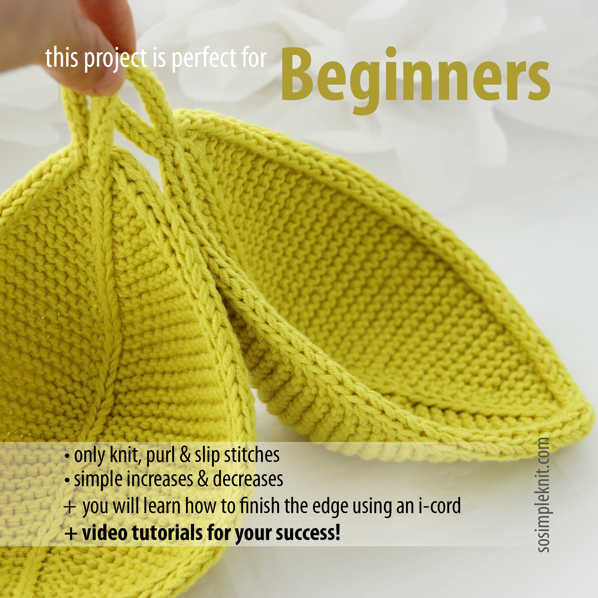 A woman’s hand holding two light green knitted leaf-shaped coasters made from the Leaf Coaster knitting pattern, showing the finished result of the design.