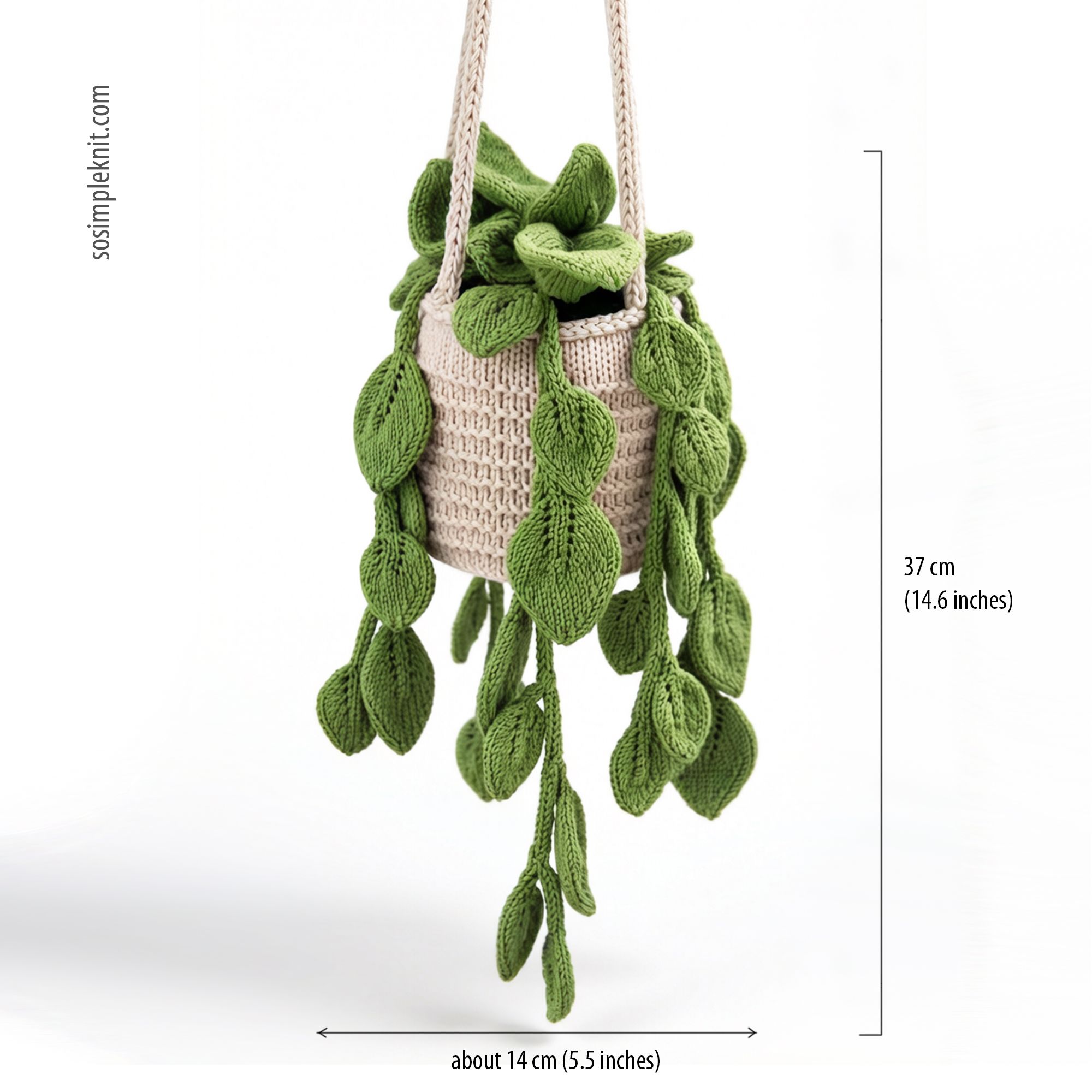The image features a knitted pothos plant suspended in a beige crochet basket. The plant is adorned with multiple green, leaf-shaped pieces that hang down, mimicking the appearance of real pothos foliage. The colors used are various shades of green for the leaves and a light tan for the basket. A ruler on the side indicates the height of the plant arrangement, which is approximately 37 cm (14.6 inches) tall and about 14 cm (5.5 inches) wide. The background is plain and unobtrusive.