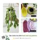 The image features a knitted pothos hanging plant with vibrant green leaves, suspended in a woven basket made of the same yarn. To the right, there are two additional pieces: a yellow leaf-shaped coaster with a coffee cup resting on it and a set of three kitchen towels in shades of pink. The background is neutral, emphasizing the colors of the knitted items. The layout is framed cleanly, showcasing each item distinctly with no distractions.