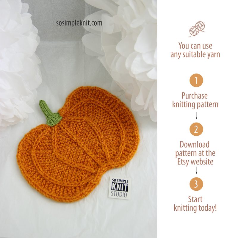 The image features a knitted pumpkin coaster in vibrant orange color with a textured, raised pattern. The pumpkin has a green knitted stem and is placed on a neutral-colored background. Flanking the pumpkin are two large, fluffy white decorative elements, enhancing the overall aesthetic. To the right, there are text instructions for purchasing and downloading the knitting pattern, styled in a clean, modern font. The overall composition is simple and focused, emphasizing the knitted pumpkin desig