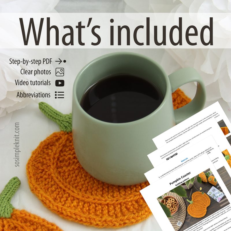 A light green mug filled with dark liquid sits on a crocheted pumpkin coaster in orange and green. In the foreground, there are printed sheets displaying a knitting pattern, with images and text visible. The background is softly blurred, enhancing the focus on the mug and coaster, while a bright white surface serves as the base, giving an airy feel to the composition.