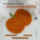 The image features a knitted pumpkin in vibrant orange with textured stitches resembling a pumpkin's surface. It has a green knitted stem at the top and is placed on a light gray background. Surrounding the pumpkin are soft white fabric flowers that frame the subject. Text overlays indicate that the project is suitable for intermediate knitters, along with instructions and a website link visible in the bottom corner. The overall composition emphasizes the pumpkin while providing relevant informa