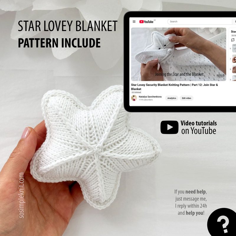The image features a person's hand holding a white, knitted star-shaped lovey, which appears fluffy and soft. A tablet is positioned beside the hand, displaying a video tutorial titled "Star Lovey Security Blanket Pattern." The setting is bright and minimalistic, with a light background that emphasizes the blanket and the tablet. The text on the image mentions the pattern and offers additional help via YouTube. The overall color scheme is predominantly white, creating a clean and inviting look.